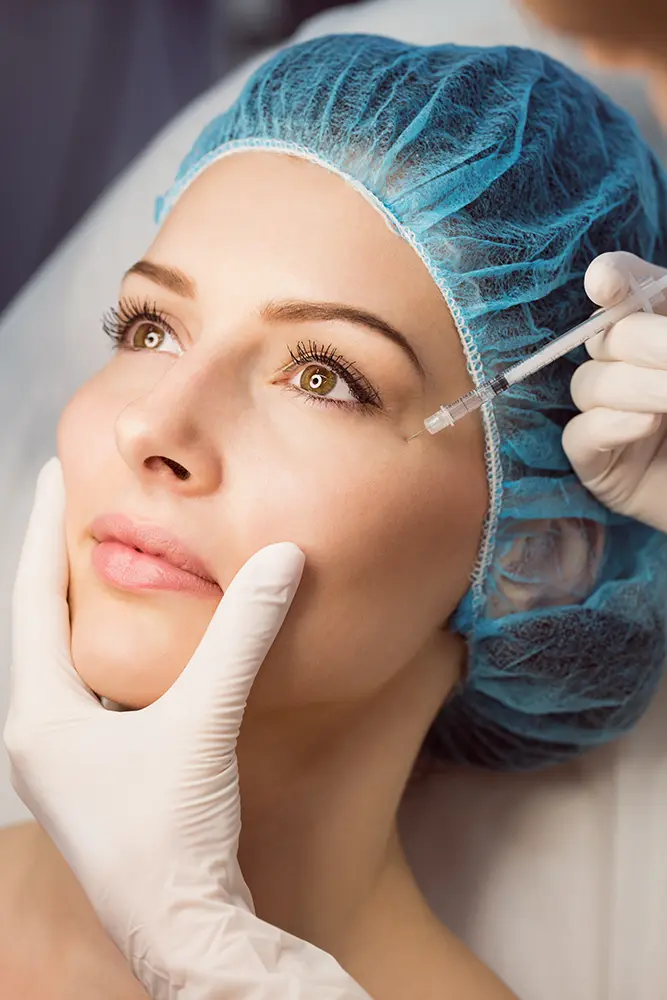 Female receiving injection on her face