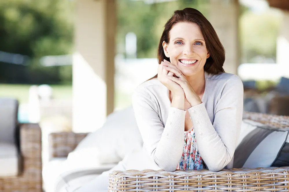 Happy woman on a sofa