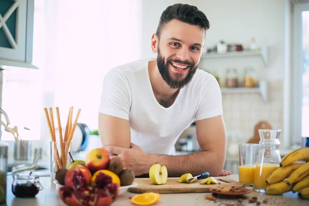 Man smiling in the kitchen
