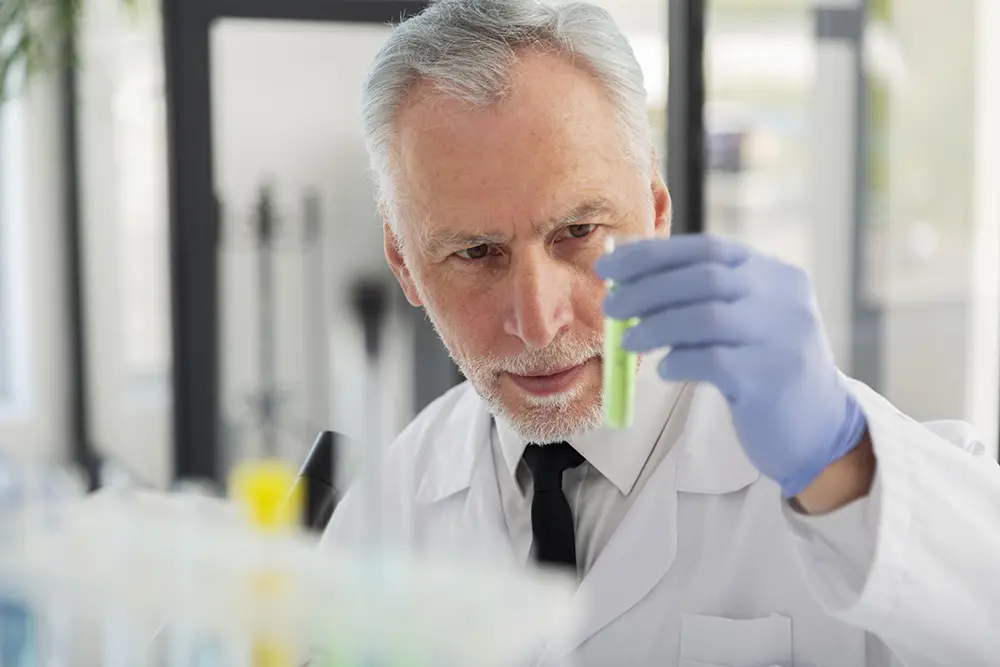 Scientist holding vial