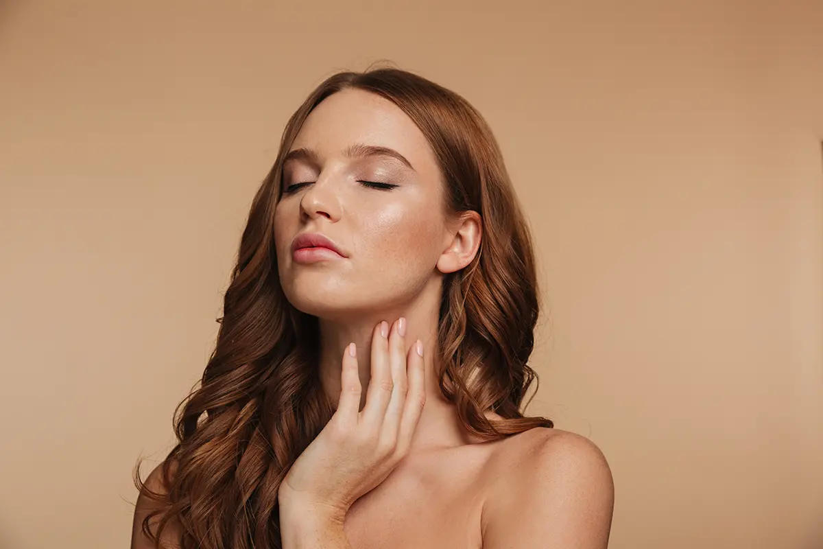 Beauty portrait sensual ginger woman with long hair posing with closed eyes